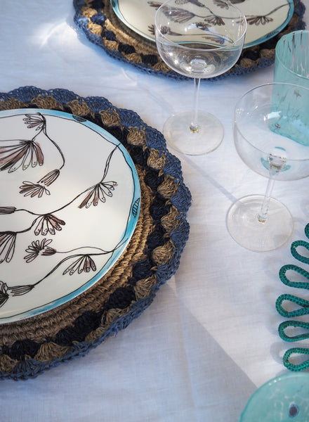 SET OF 2 PETAL PLACEMATS - Pair of large, hand-woven raffia placemats in baby blue and navy - Lifestyle