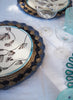 SET OF 2 PETAL PLACEMATS - Pair of large, hand-woven raffia placemats in baby blue and navy - Lifestyle