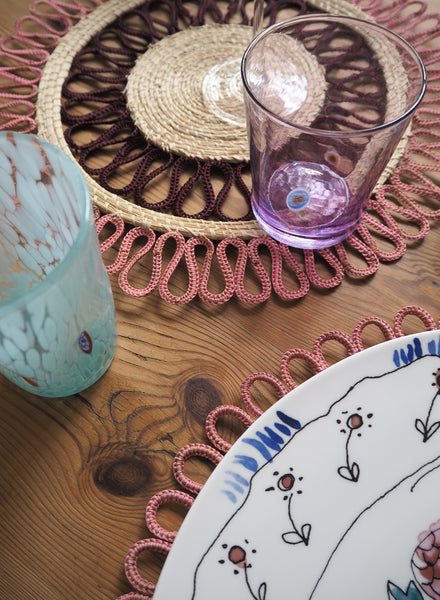 SET OF TWO MAGNOLIA PLACEMATS - Pair of large, hand woven raffia placemats in burgundy and pink - Lifestyle