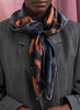 JANE CARR The Kitty Foulard in Guinness, brown and blue grey printed silk twill scarf – model
