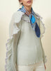JANE CARR The Dazzle Petit Foulard in Mid Blue, blue multicolour printed silk twill scarf – model