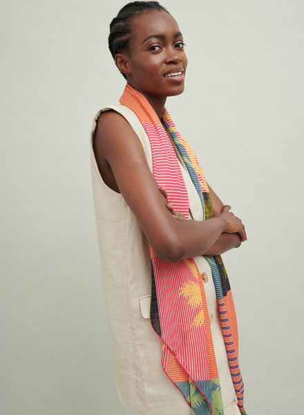 The Paradise Square, orange, pink and blue printed modal cashmere-blend scarf – model 1